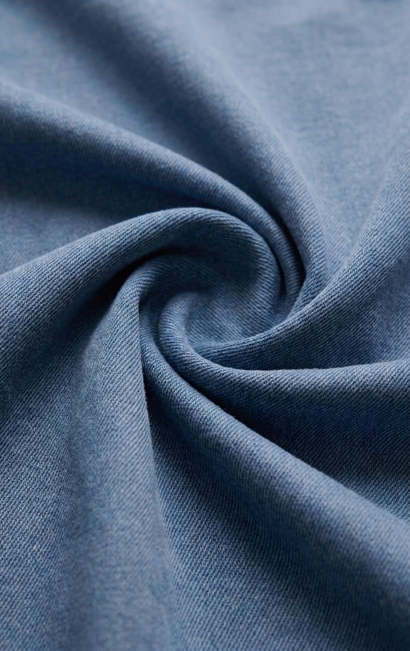 Close-up of blue fabric with a swirl pattern